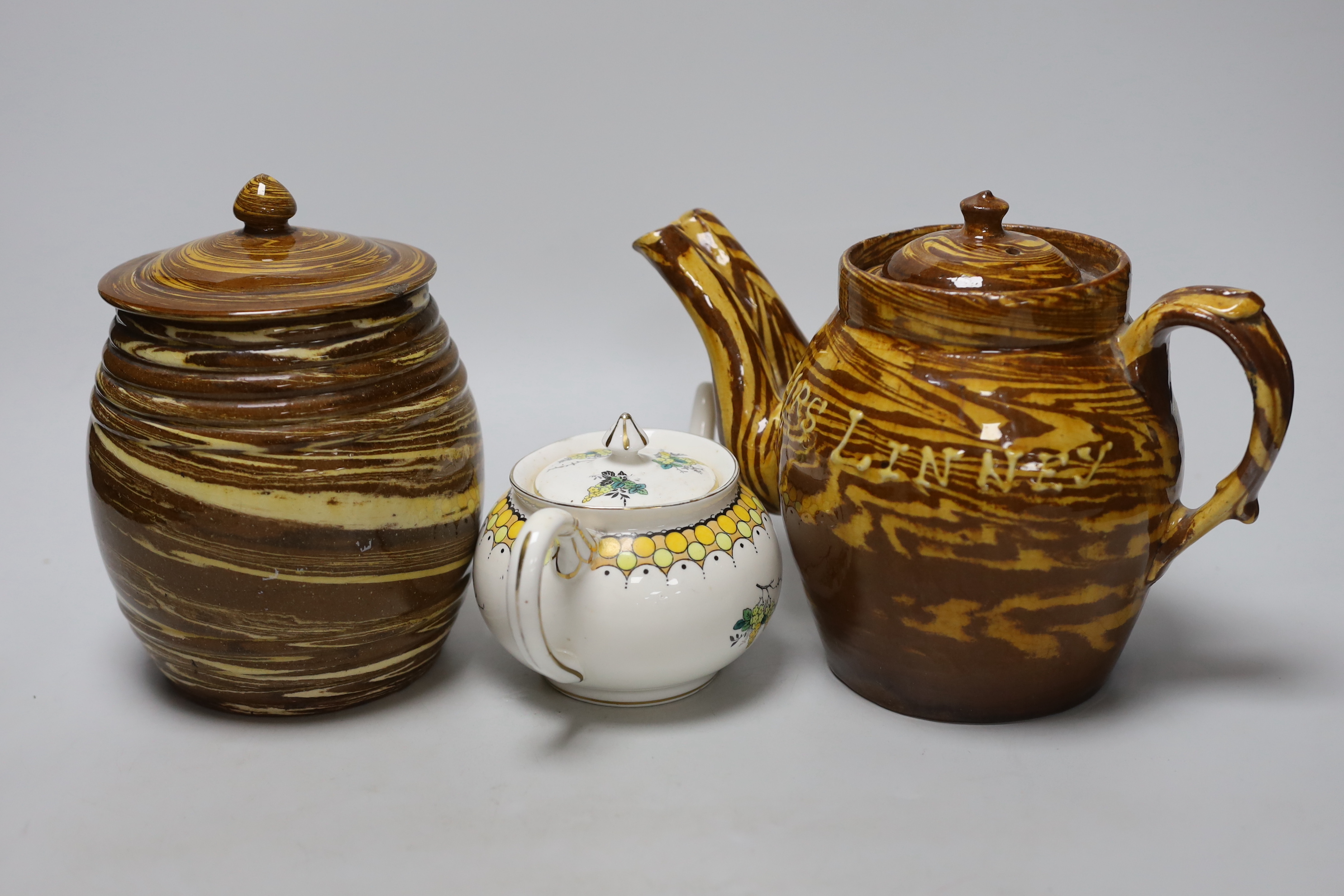 Two 19th century and later teapots including and a Harrods Stella example lidded pottery sugar jar dated 1888, the largest 20cm high